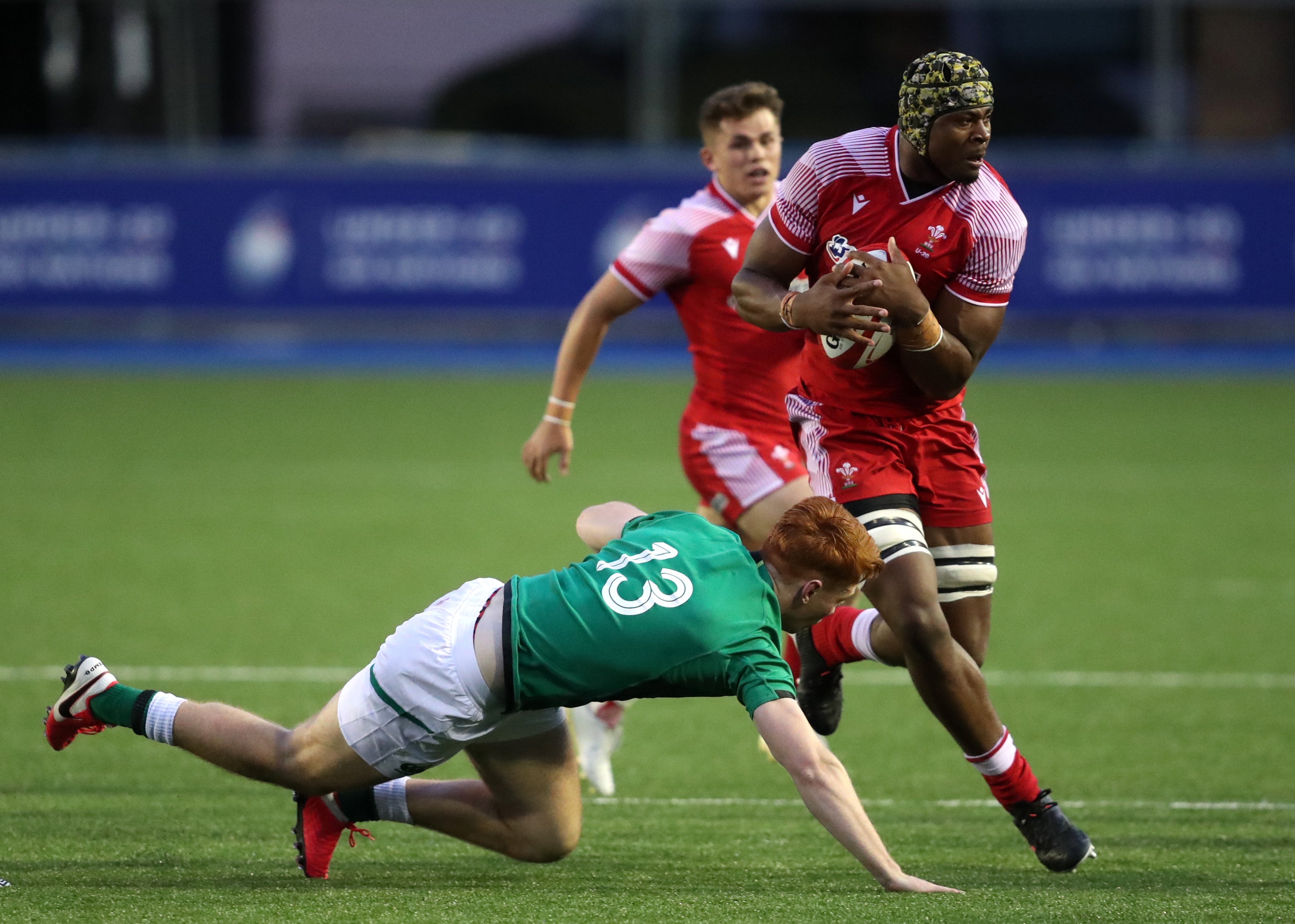 Christ Tshiunza (right) in action for Wales Under-20s (David Davies/PA)