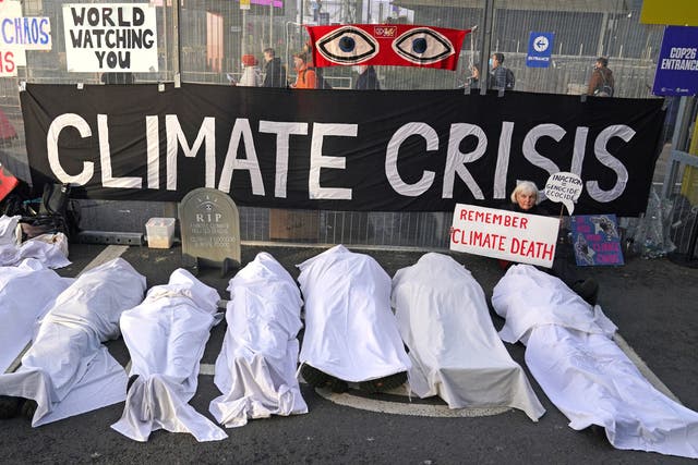 <p>Climate protesters at Cop26, which academics have warned is a “failure” </p>