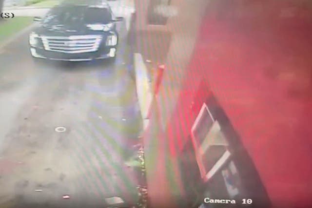 <p>Video shows the car being ambushed by three gunmen in North Miami Beach on Saturday</p>