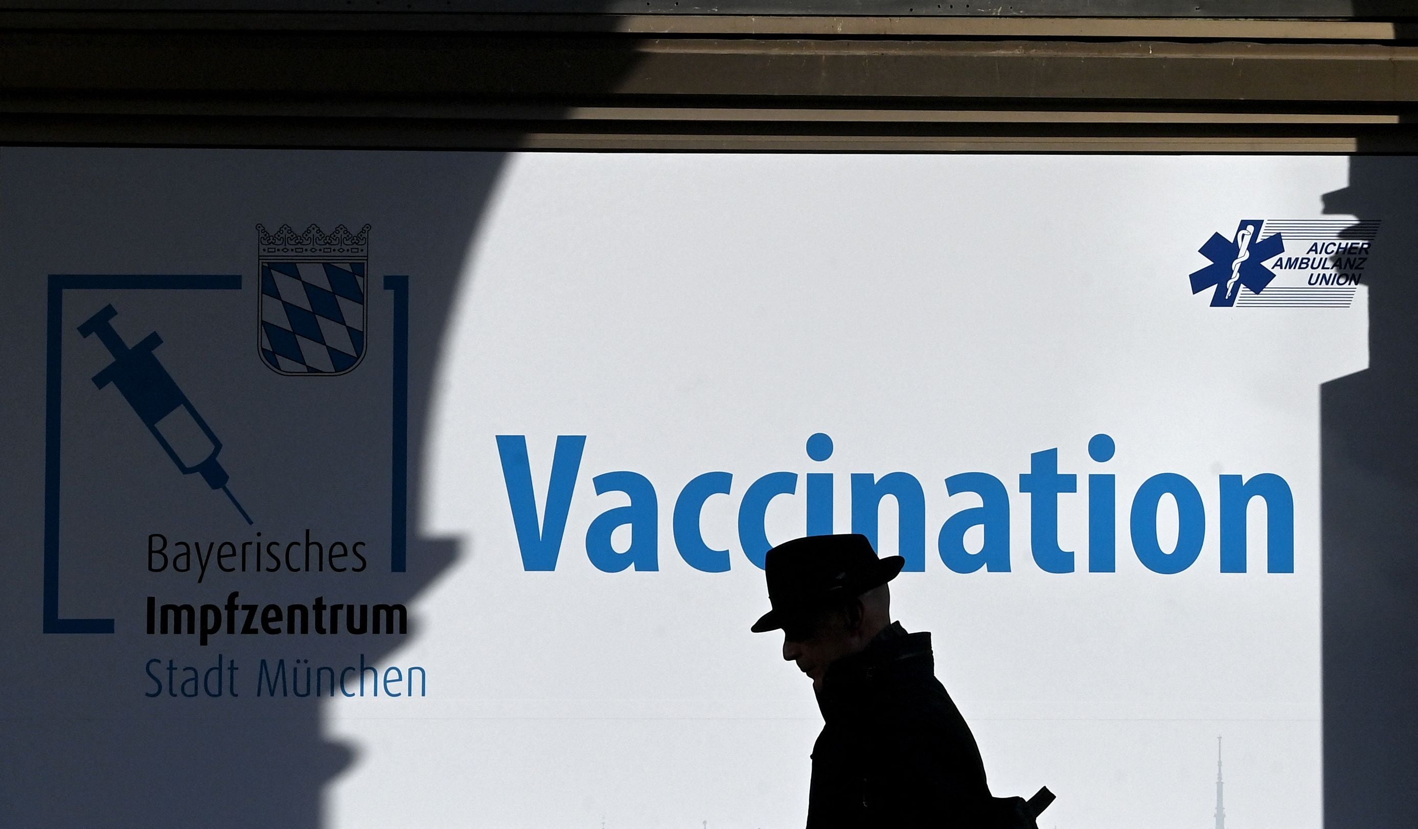 A man walks past a vaccination centre in Munich