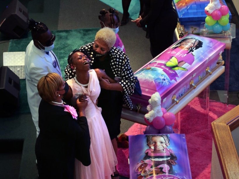 Sabrina Dunigan had to be helped through the 21 August funeral for her five children. She now faces charges in connection with the deaths of Heaven and Neveah Dunigan, 8; Deontae Davis Jr, 9; Jabari Johnson, 4; and Loy-el Dunigan, 2