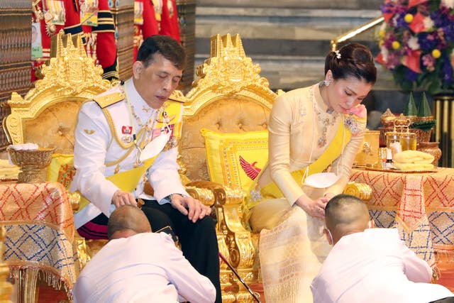<p>File Thai King Maha Vajiralongkorn Bodindradebayavarangkun (L) is accompanied by Thai Queen Suthida (R) during a religious ceremony</p>