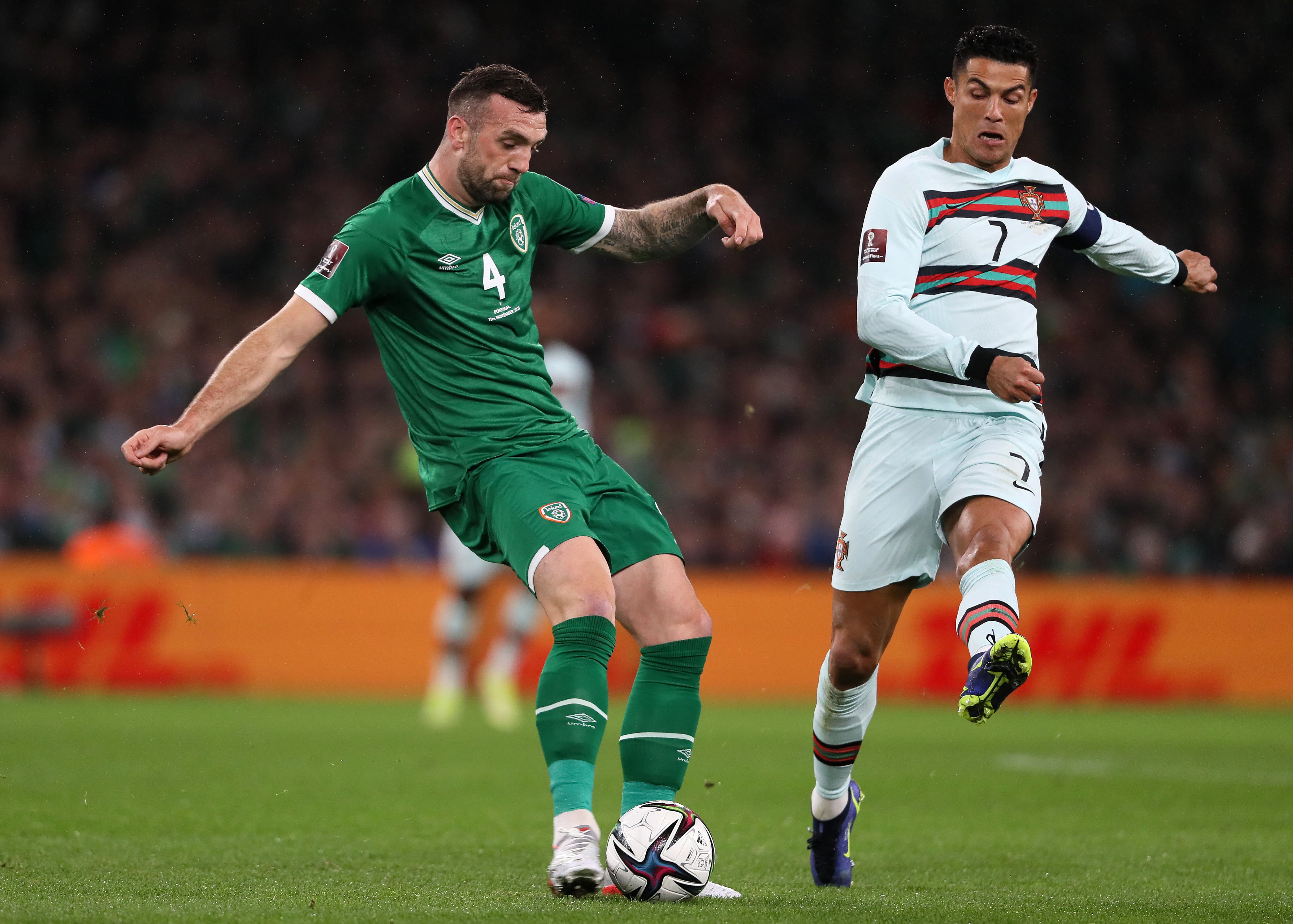 Republic of Ireland defender Shane Duffy (left) clears the ball under pressure from Portugal’s Cristiano Ronaldo (Brian Lawless/PA)