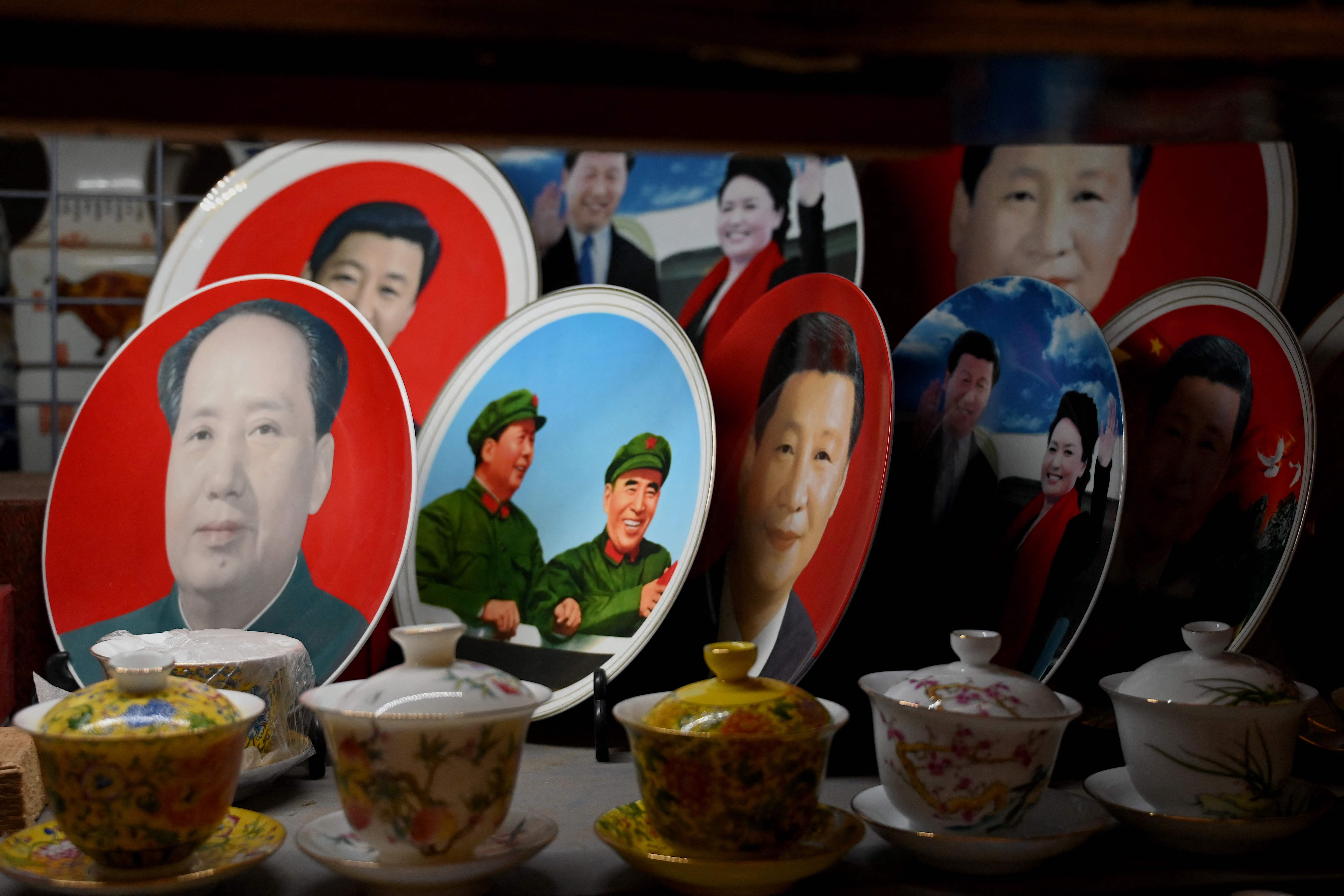 Decorative plates featuring images of Chinese president Xi Jinping and late leader Mao Zedong