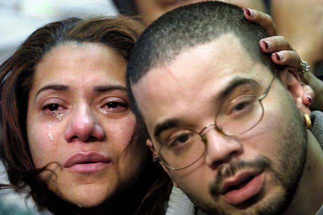 <p>Maxima Nunez and Carlos Morales grieve at a service for family members of the victims of the American Airlines Flight 587 crash on 12 November 2001 in New York City. Morales lost both his parents in the crash</p>