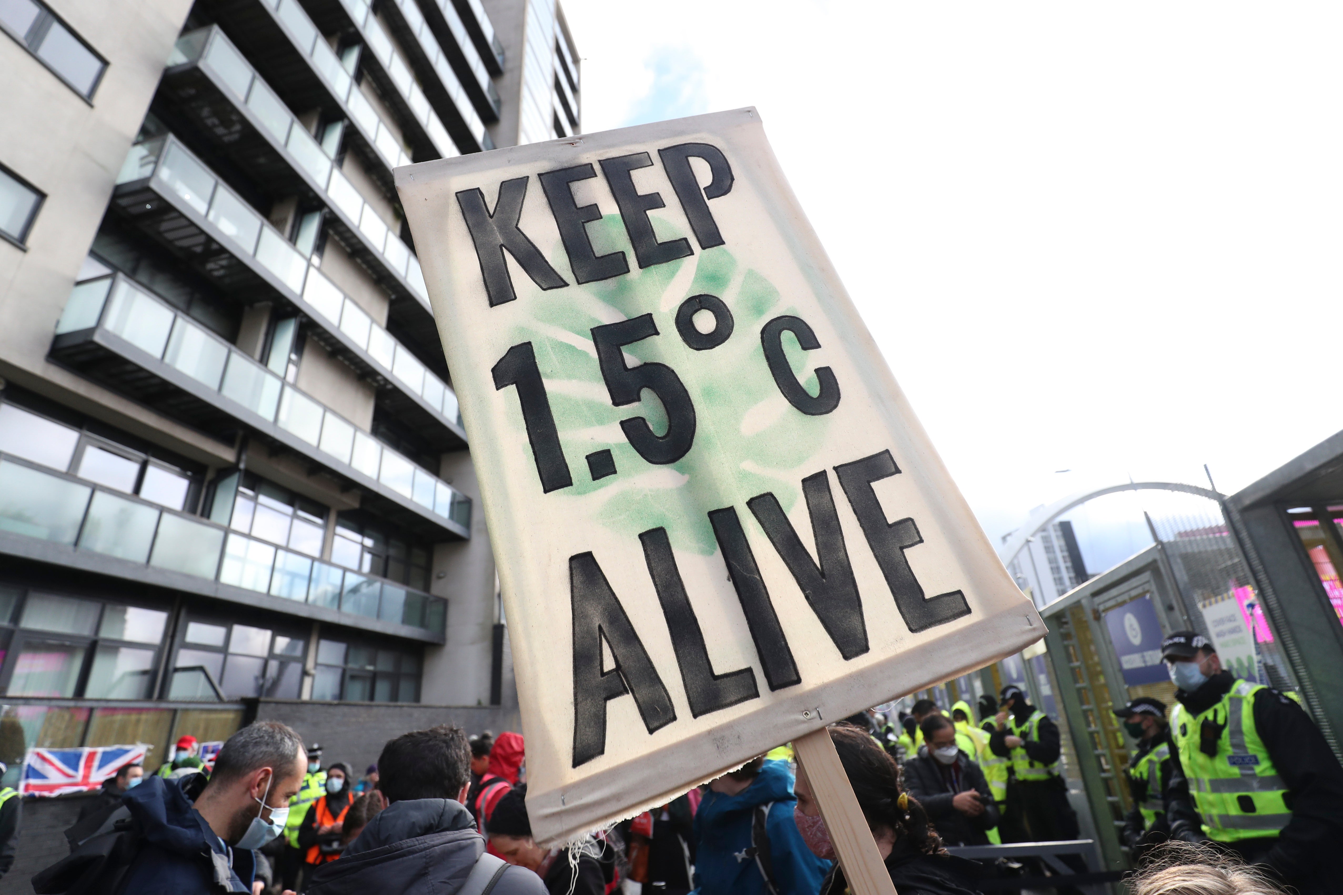 Climate activists take part in a demonstration outside Cop26 in Glasgow on Friday