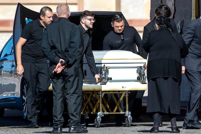 <p>Pallbearers prepare to bring in the casket of Tina Tintor before a memorial at St. Simeon Serbian Orthodox Church in Las Vegas Thursday, Nov. 11, 2021. Tintor, 23, was killed in a fiery crash involving former Las Vegas Raiders wide receiver Henry Ruggs III Nov. 2, in Las Vegas.</p>