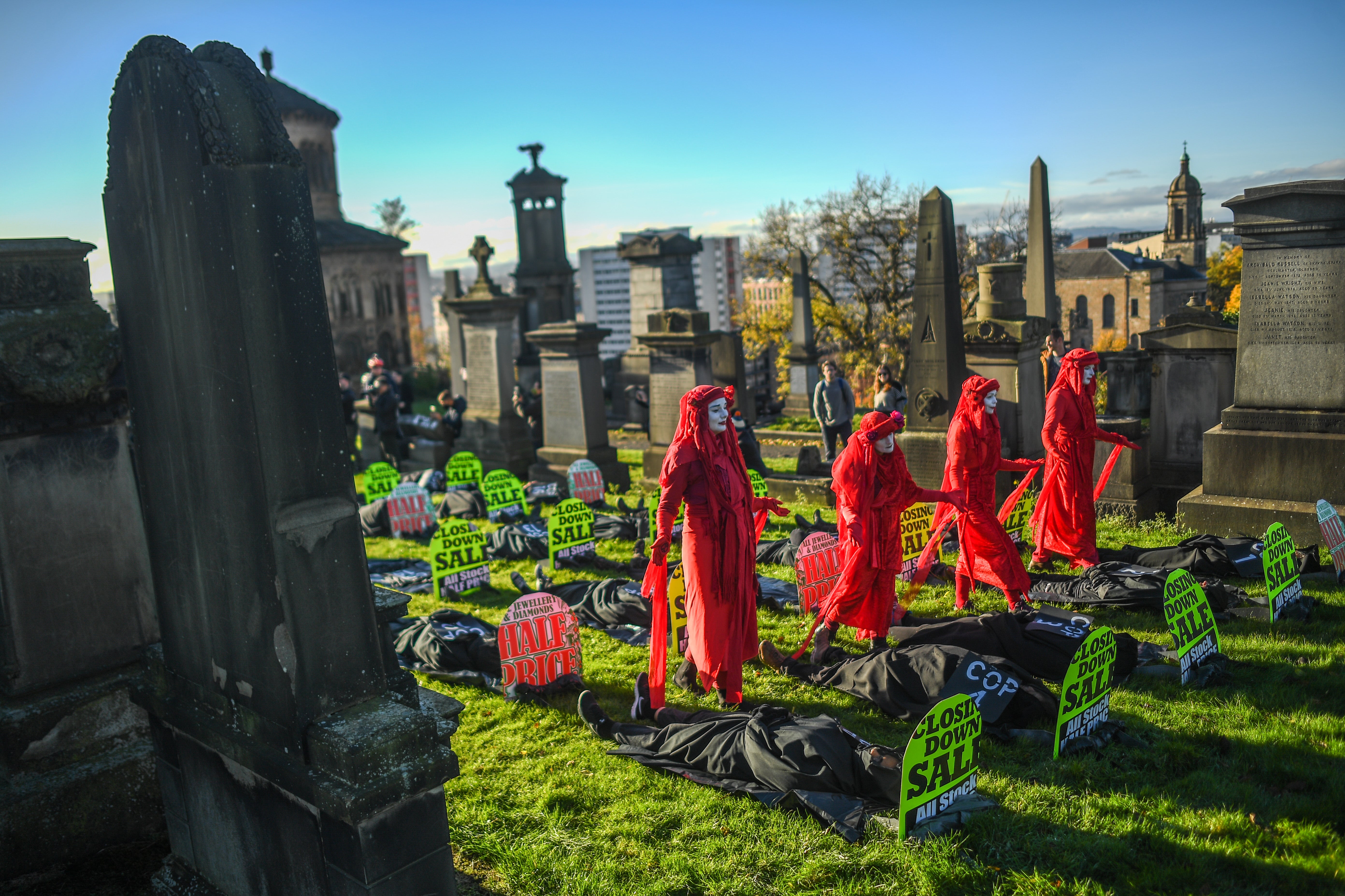 Extinction Rebellion activists are seen holding a Funeral for COP26 at the Necropolis on November 13, 2021 in Glasgow.