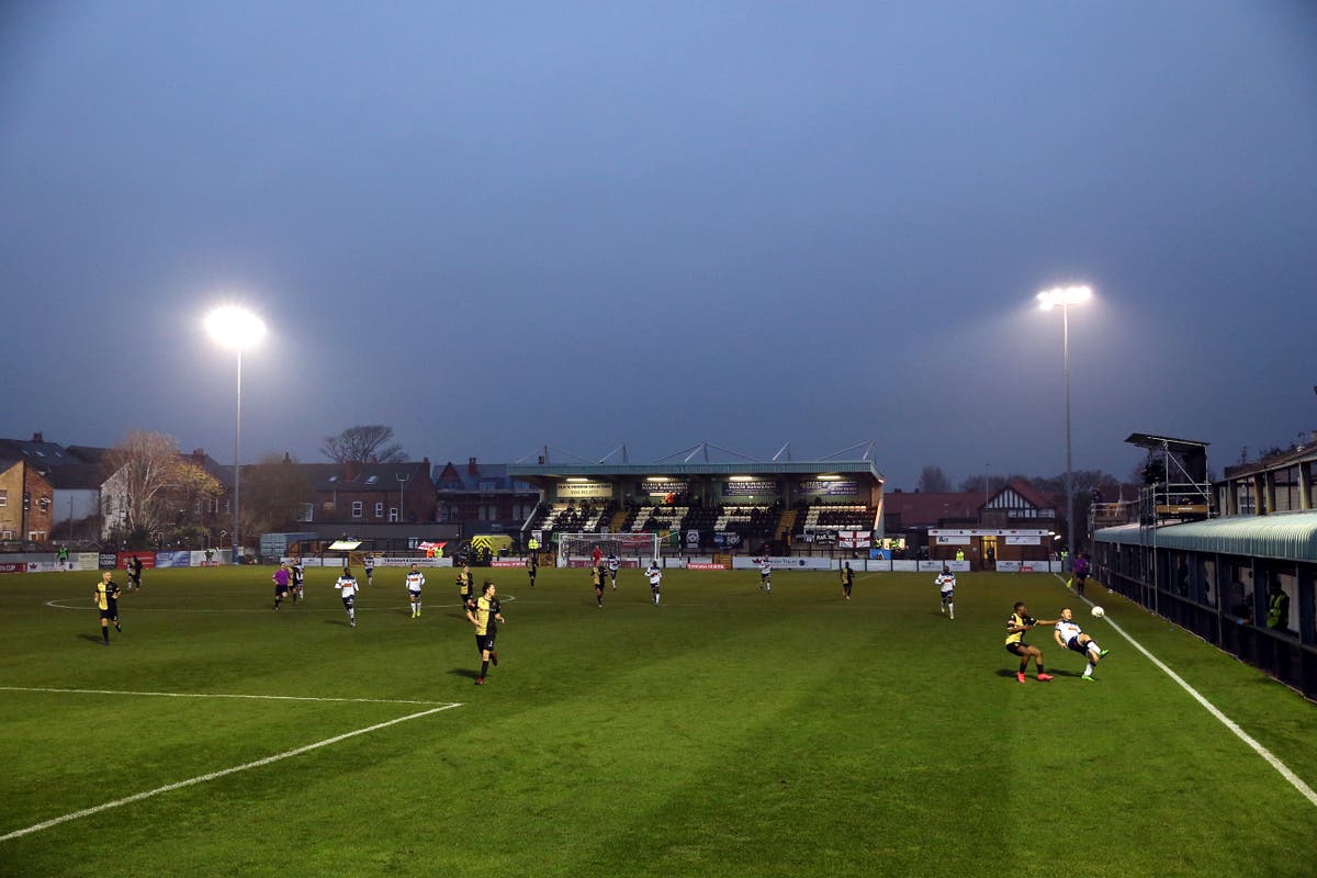 Player attempts to fix floodlights as FA Trophy clash goes down to the wire