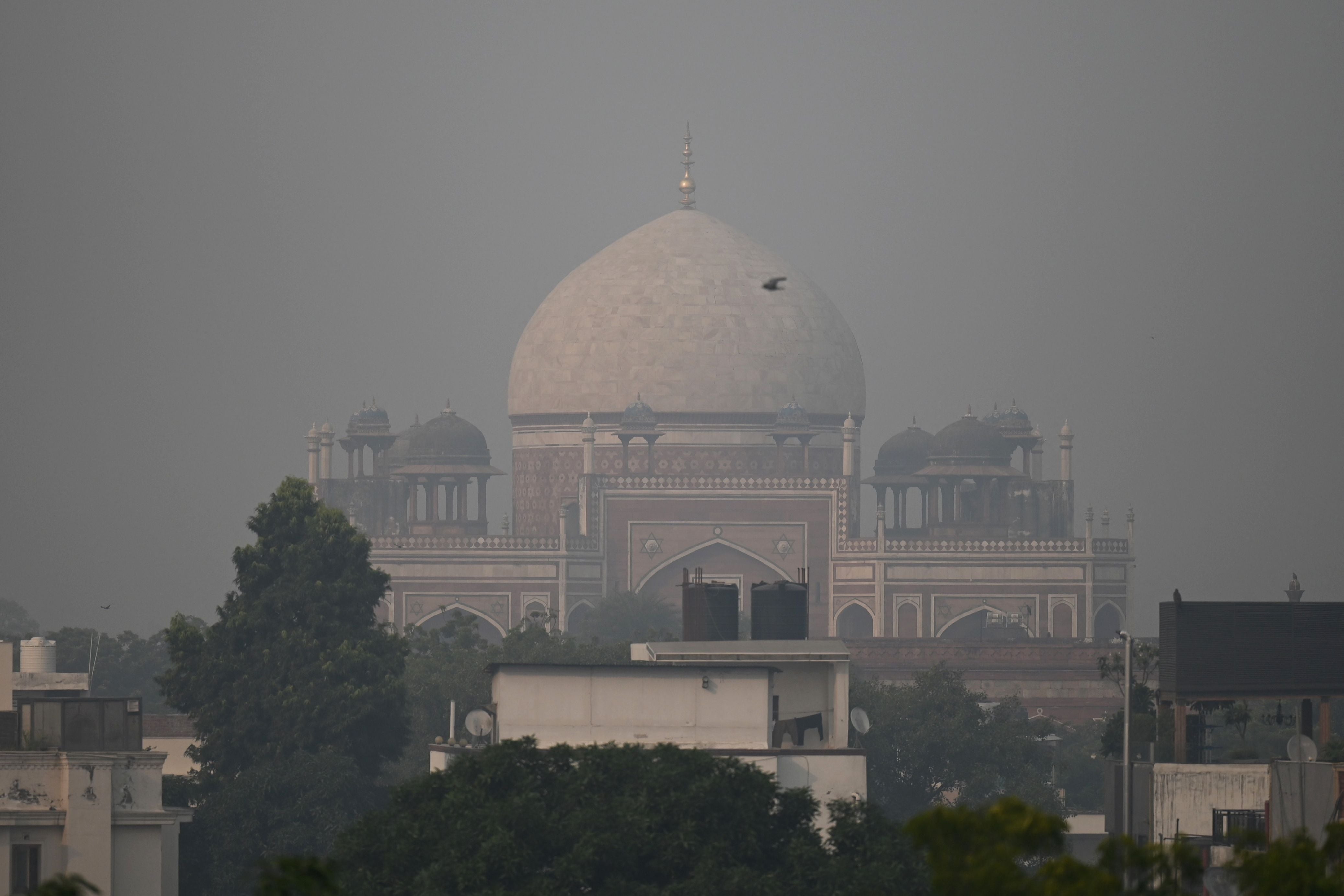 Mughal-era Humanyun’s Tomb is seen amid heavy smog conditions in New Delhi on November 11, 2021