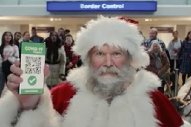 <p>‘Santa’ shows his Covid passport in Tesco Christmas ad</p>