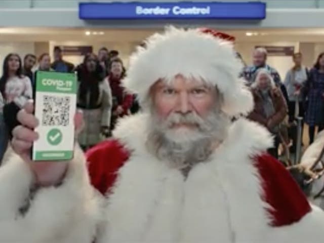 <p>‘Santa’ shows his Covid passport in Tesco Christmas ad</p>