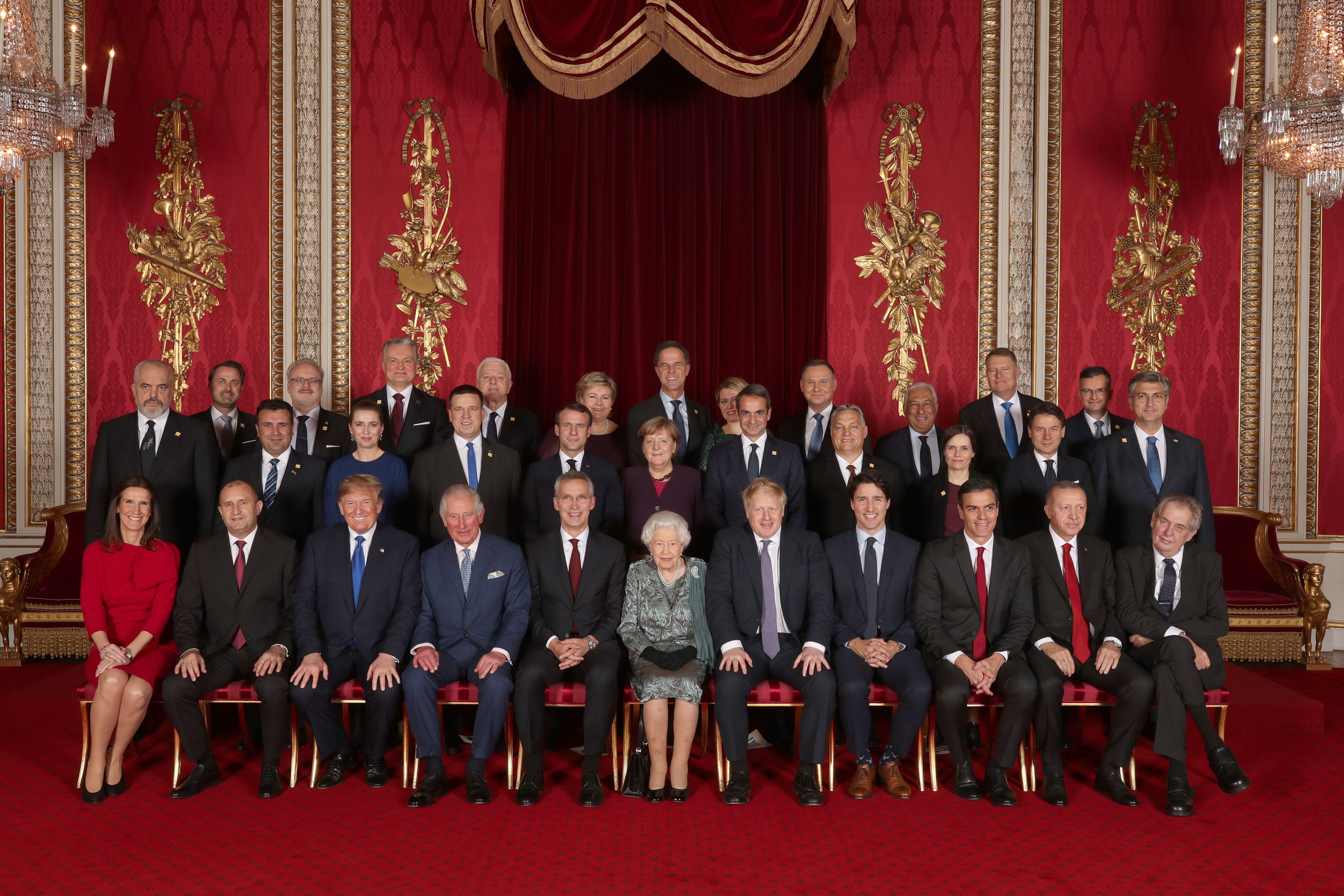 Leaders of Nato alliance countries, and its secretary general, join Queen Elizabeth and the Prince of Wales for a group picture to mark 70 years of the alliance in 2019