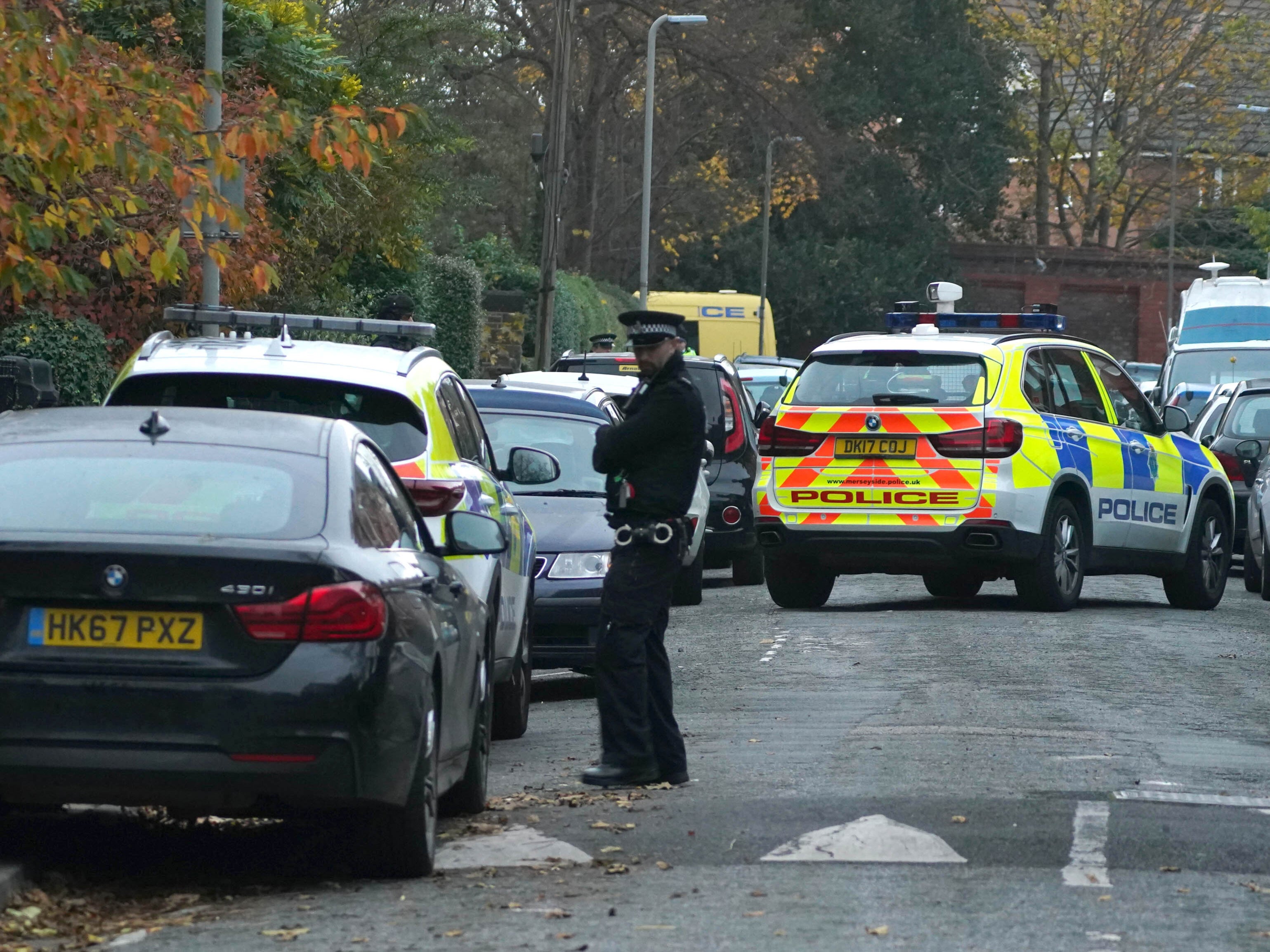 Armed police were pictured visiting an address in Liverpool after the explosion