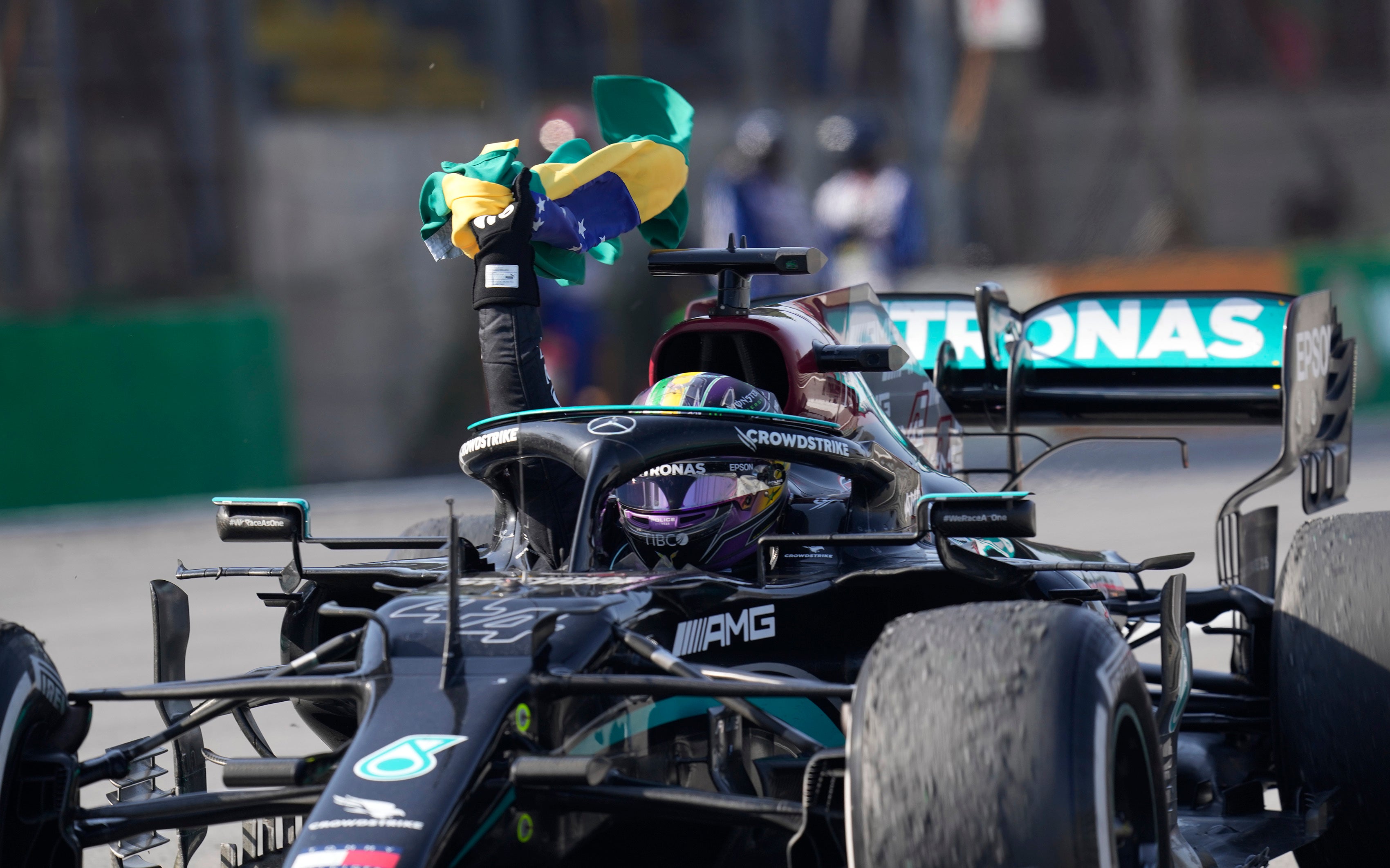 Lewis Hamilton celebrates his victory (Andre Penner/AP)