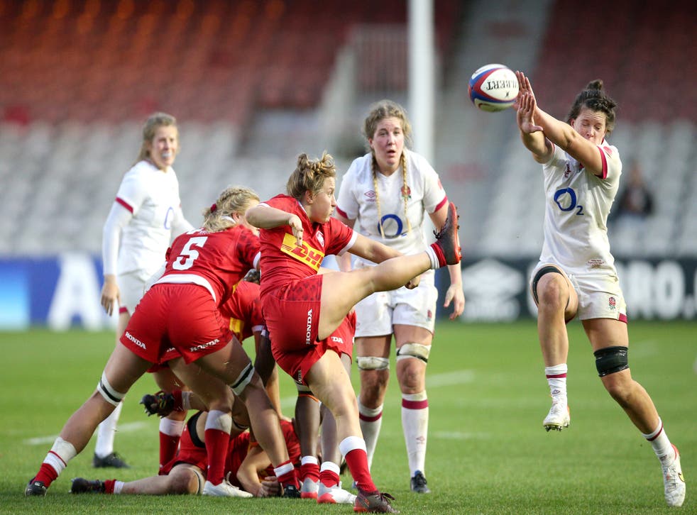 Canada’s Justine Pelletier kick is charged down by England’s Abbie Ward (Nigel French/PA)