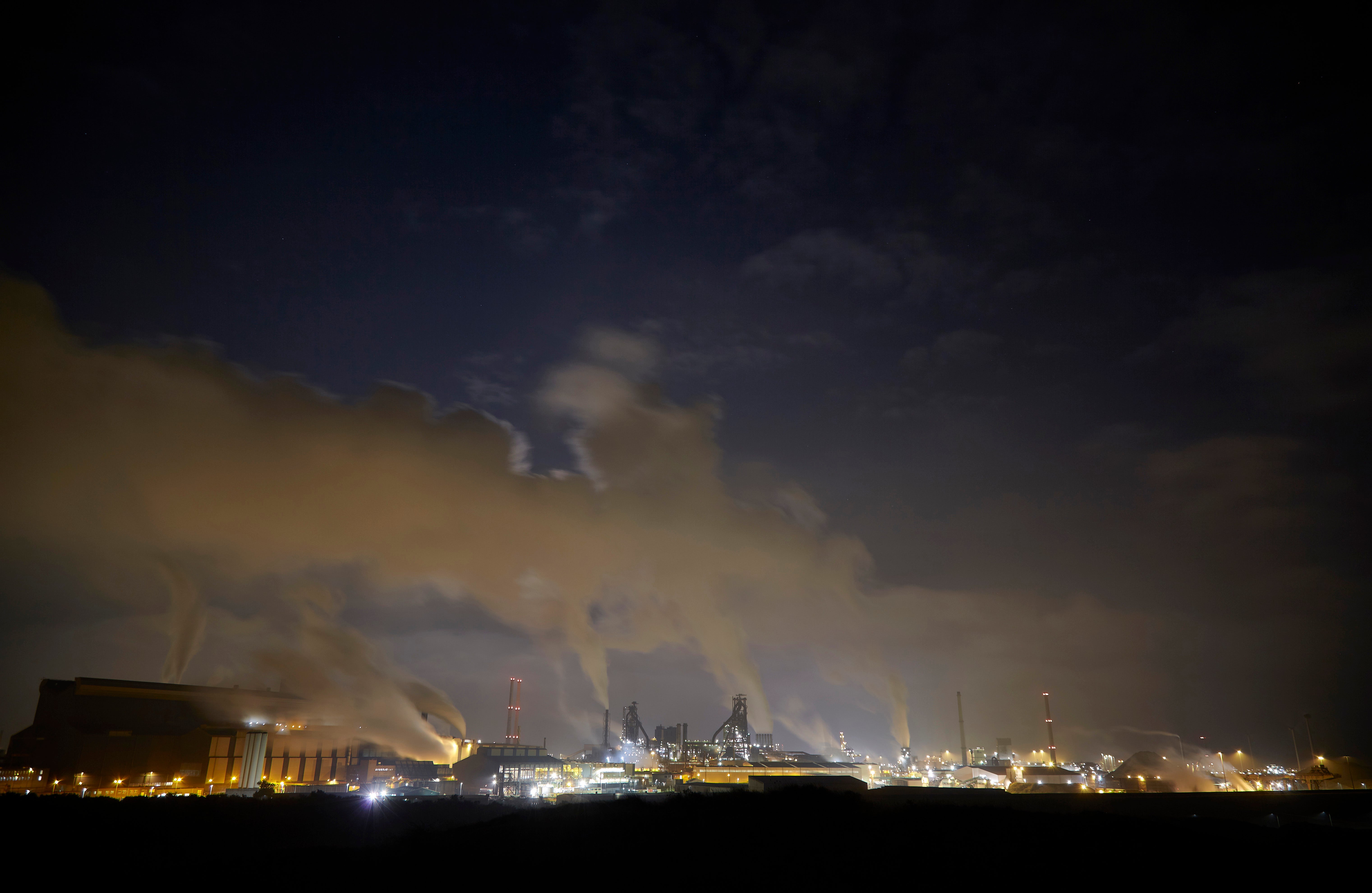 Fumes from the Tata Steel plant are seen on 20 August 2021 in Wijk aan Zee, Netherlands