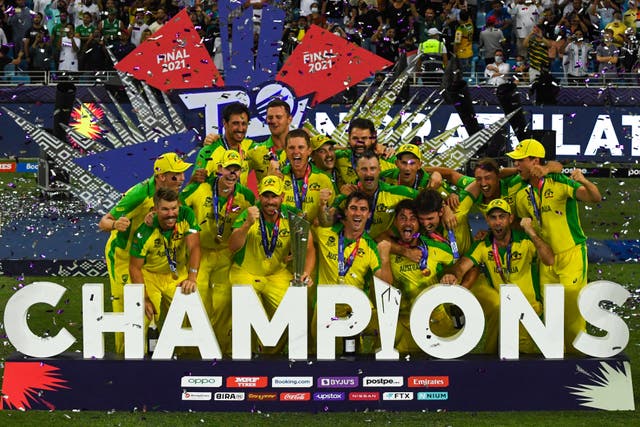 <p>Australia celebrate with the World Cup trophy in Dubai on Sunday </p>