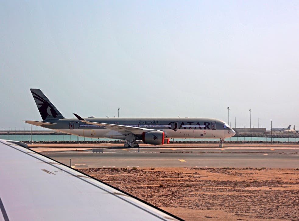 <p>File: A Qatar Airways aircraft is seen on the tarmac at Hamad International Airport in Doha </p>