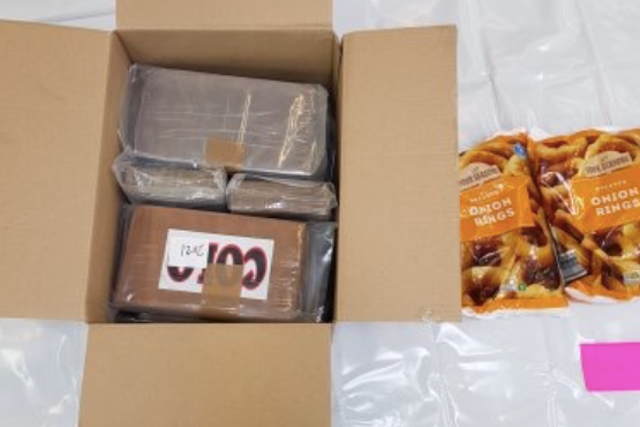 <p>Seize & onion: a picture provided by the National Crime Agency shows some of the confiscated cocaine and the onion rings it was shipped with </p>