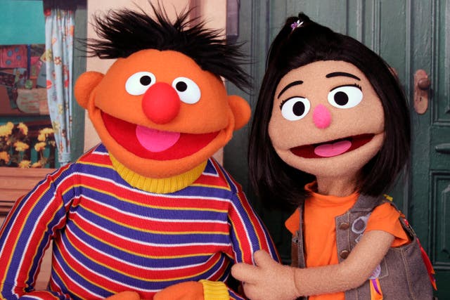 <p>Ernie, a muppet from popular children’s TV series ‘Sesame Street’ with new character Ji-Young, the first Asian-American muppet  on the show </p>