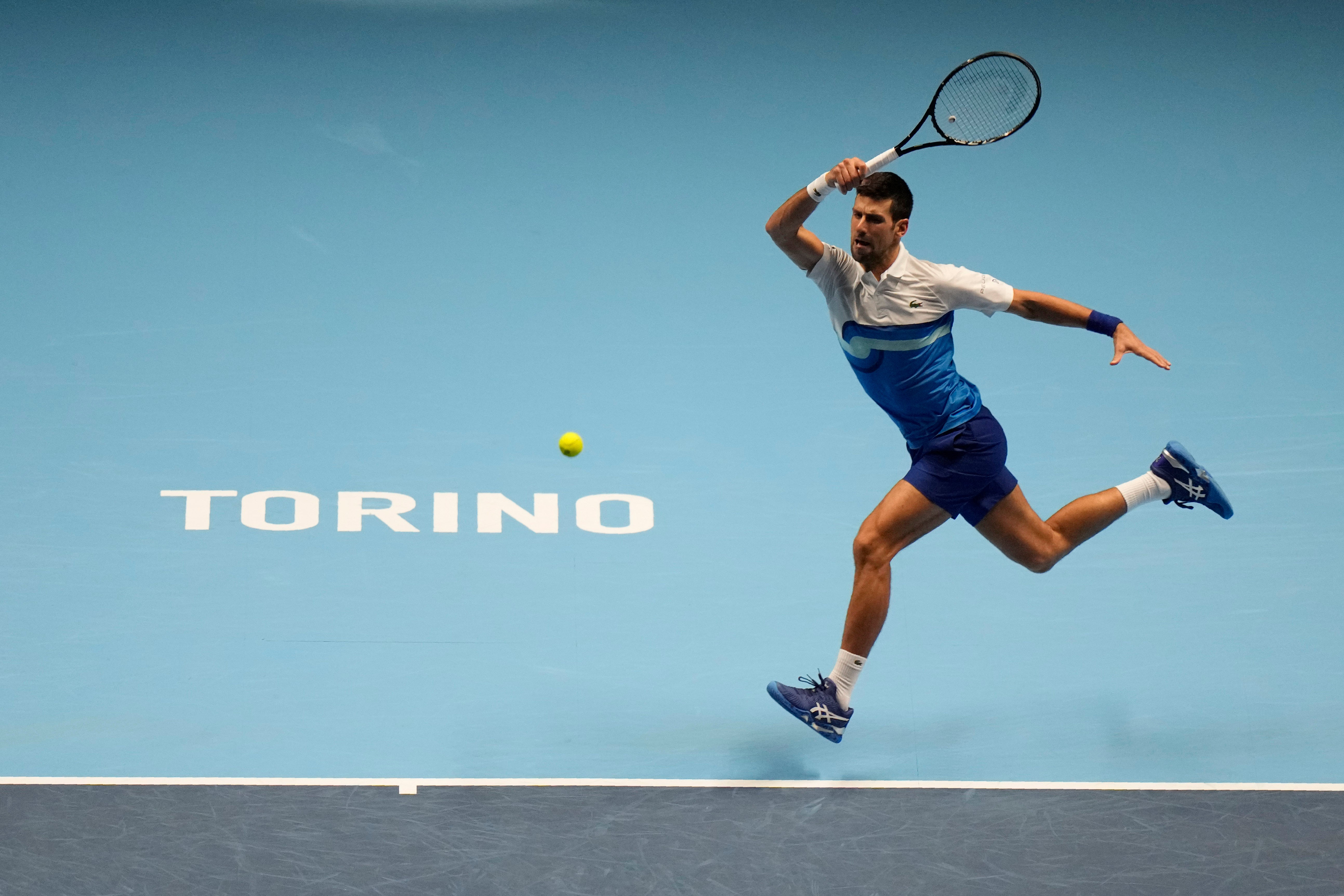 Novak Djokovic hits a running forehand