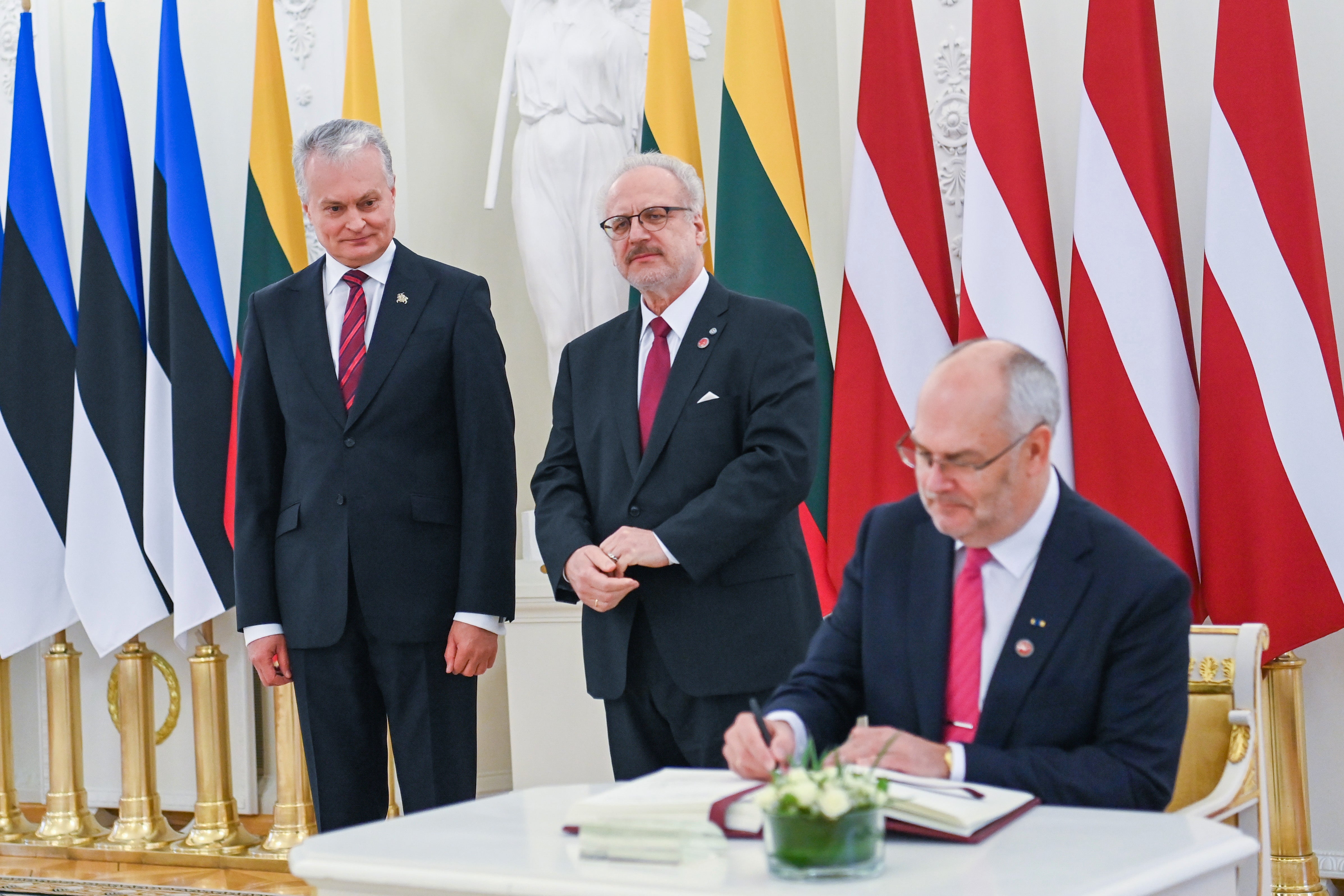 Office of the President of the Republic of Lithuania shows Estonian President Alar Karis (R), Lithuanian President Gitanas Nauseda (L) and Latvian President Egils Levits during their meeting in Vilnius