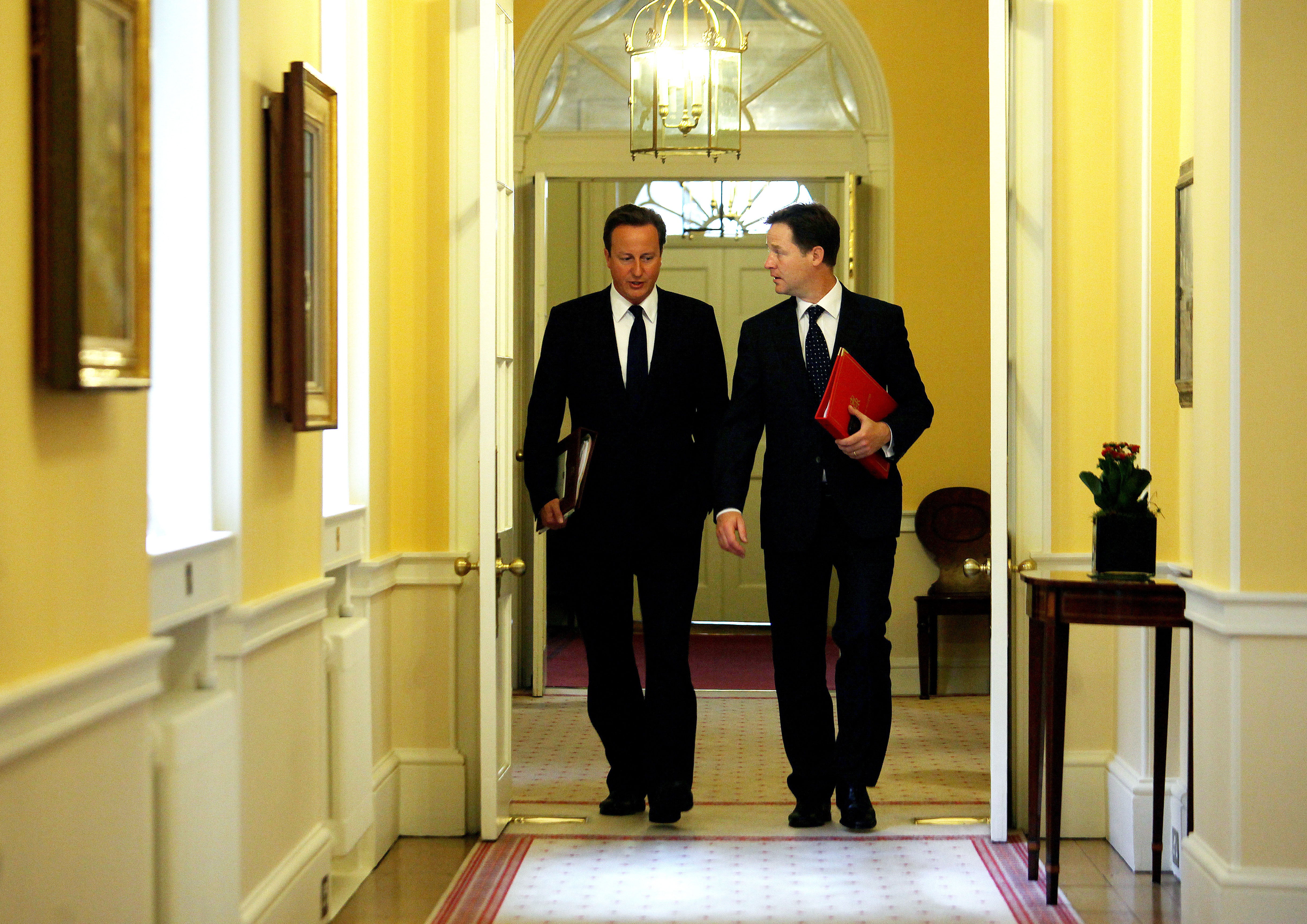 Cameron and Clegg arrive for their first cabinet meeting at Downing Street after the summer break