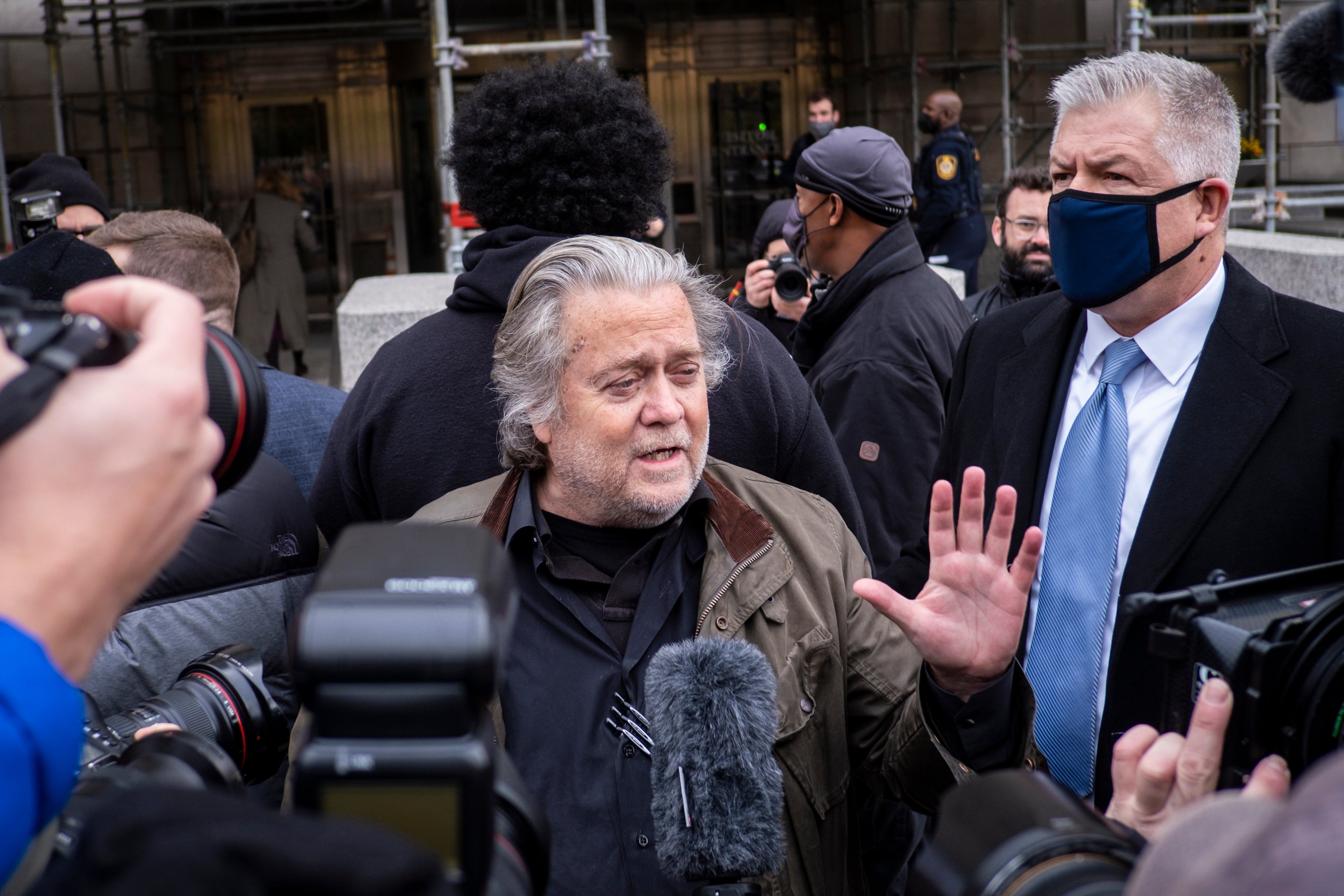 Trump ally and former White House adviser Steve Bannon arrives to turn himself into authorities at the FBI Field Office in Washington, DC, on Monday