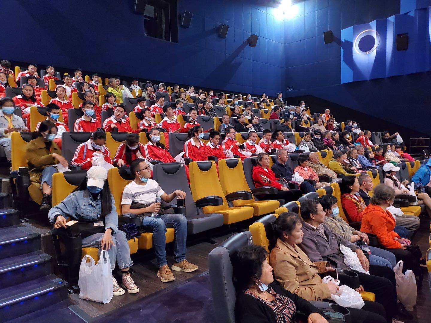 Blind and partially sighted moviegoers enjoy a narrated film at a cinema in Kunming, Yunnan province