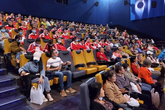 <p>Blind and partially sighted moviegoers enjoy a narrated film at a cinema in Kunming, Yunnan province</p>