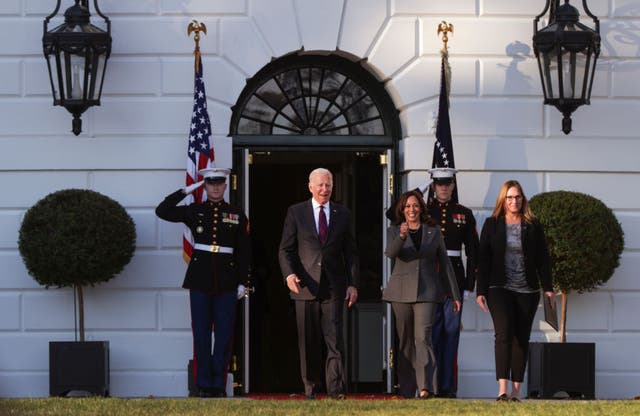 <p>President Joe Biden and Vice President Kamala Harris emerge from the White House for a signing ceremony on Monday</p>