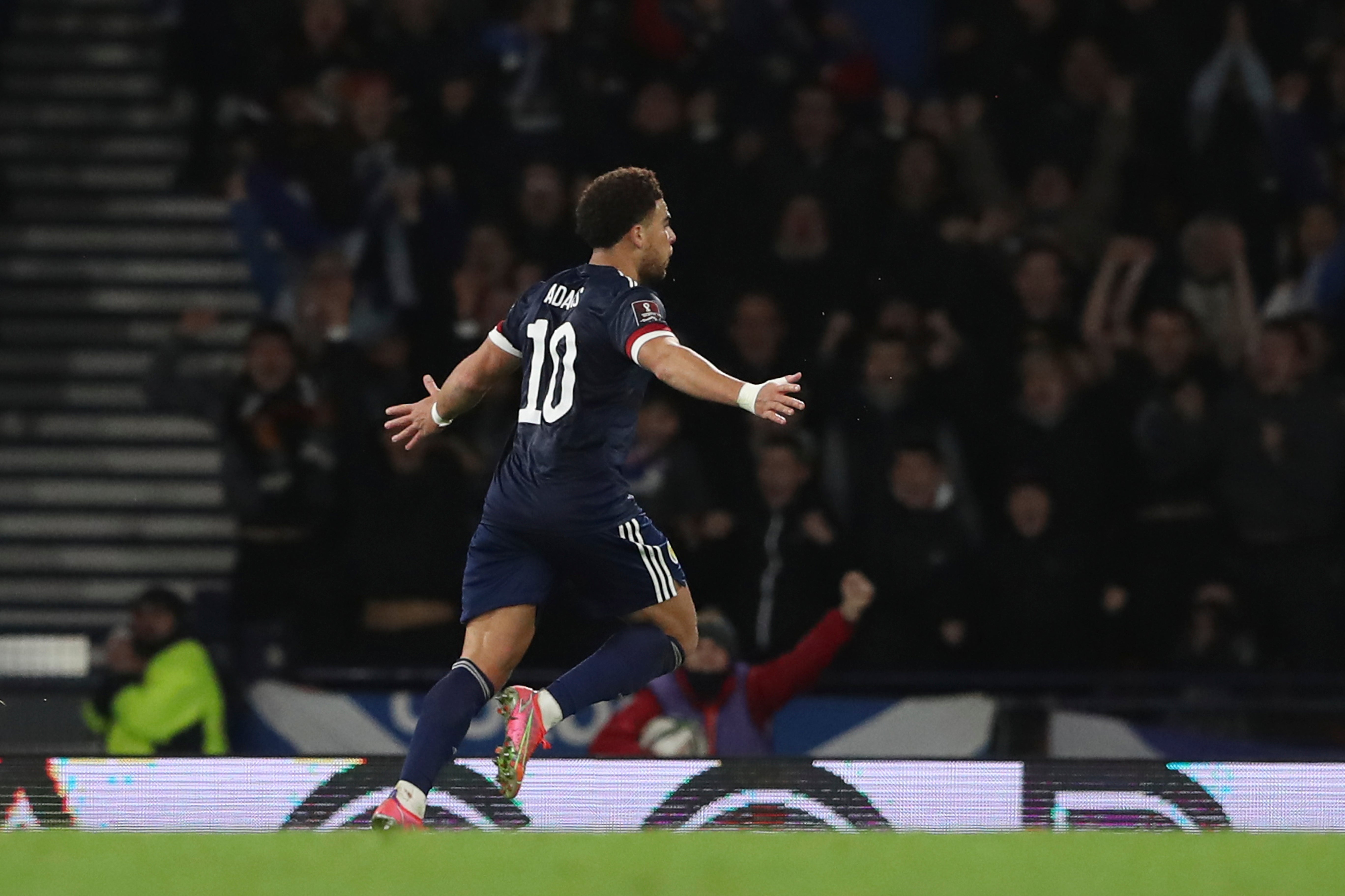 Che Adams celebrates his and Scotland’s second goal (AP/Scott Heppell)