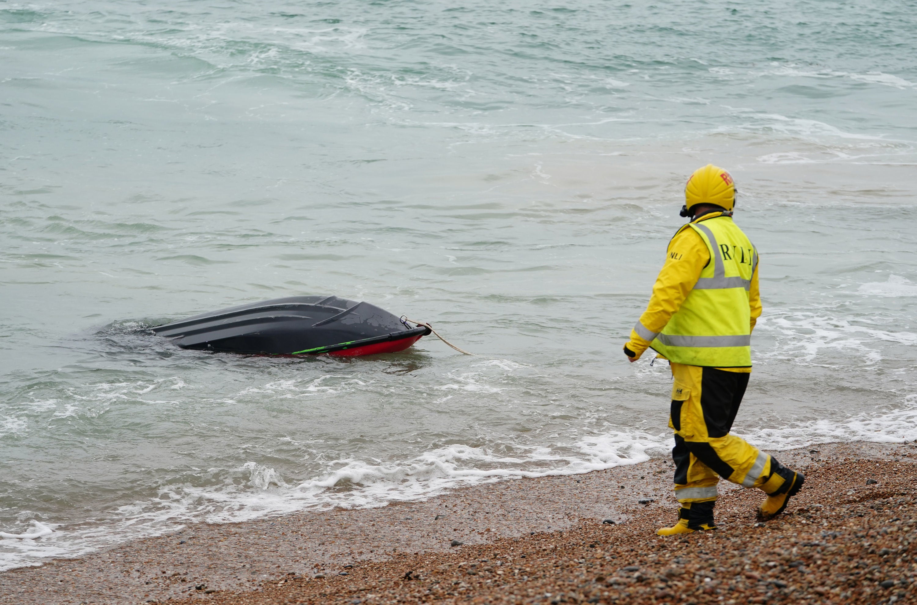 A jet ski thought to have been used in a migrant crossing is brought in to Dungeness, Kent, by the RNLI after being intercepted in the Channel.