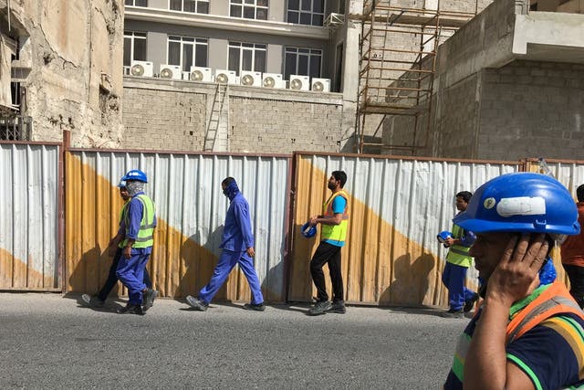 <p>Construction workers in Doha, Qatar</p>