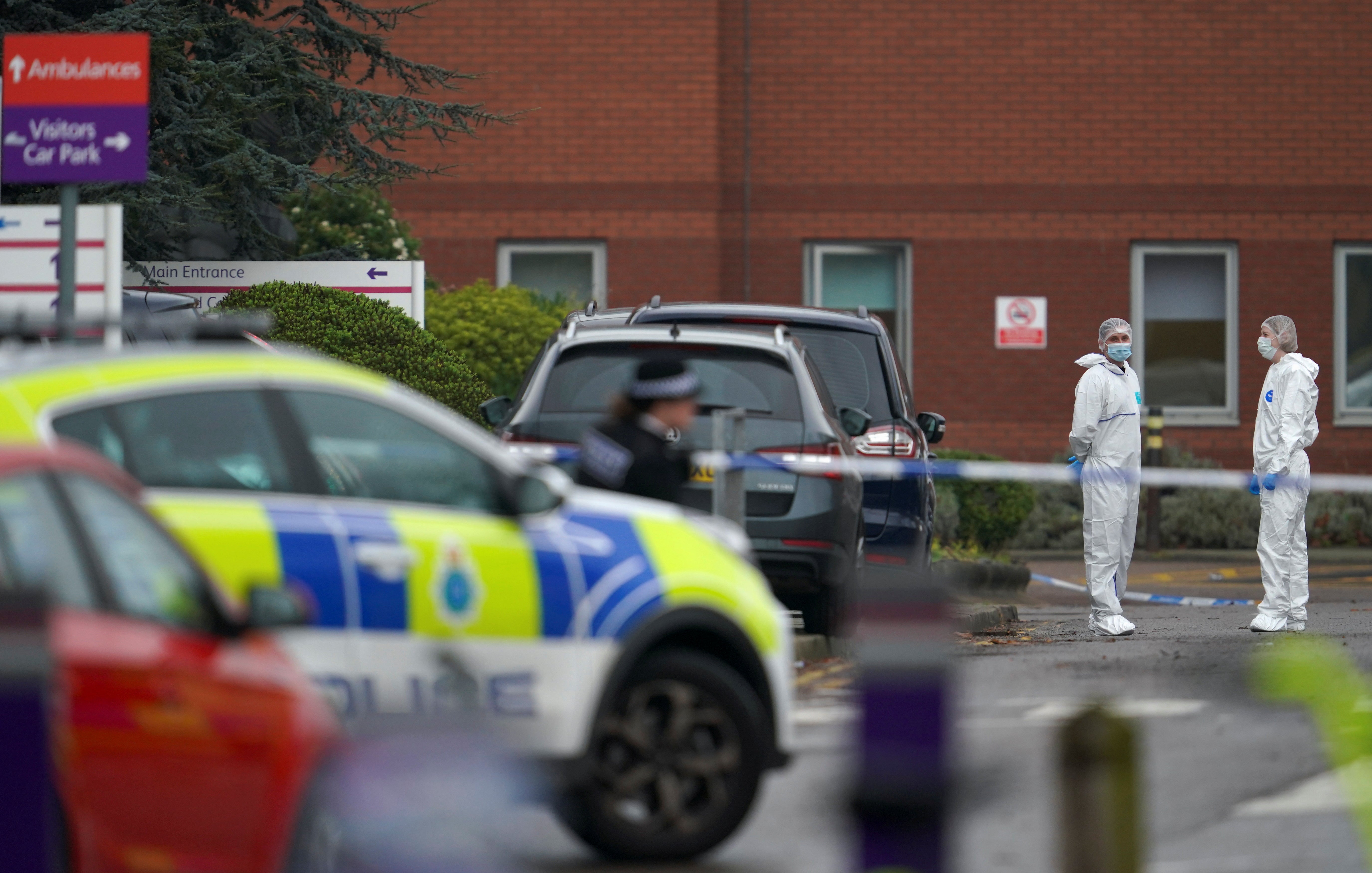 Members of forensic police stand at the site of the blast