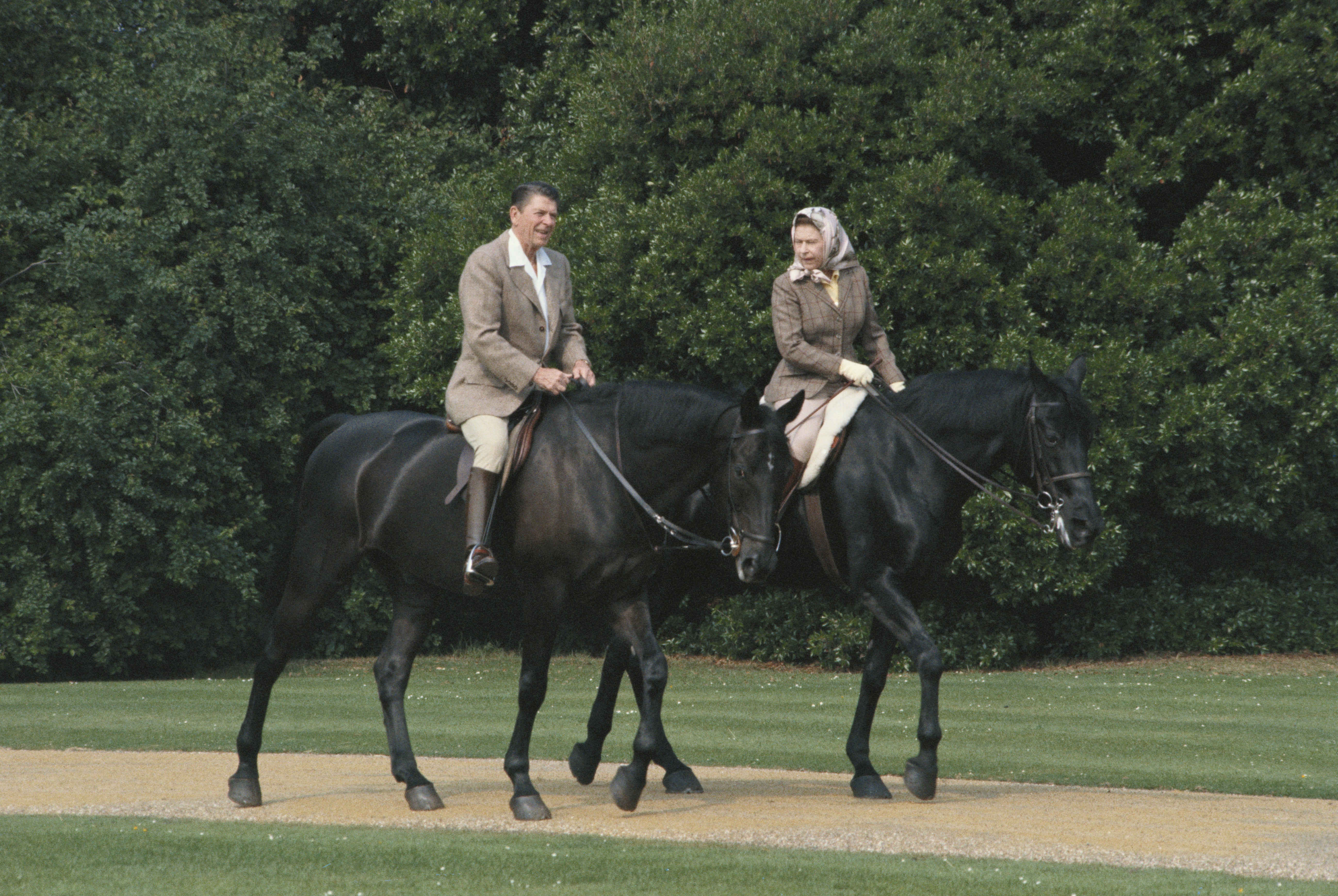 The Queen riding with Ronald Reagan at Windsor in June 1982. The US president wrote in his diary that the day had been ‘a fairy tale experience’