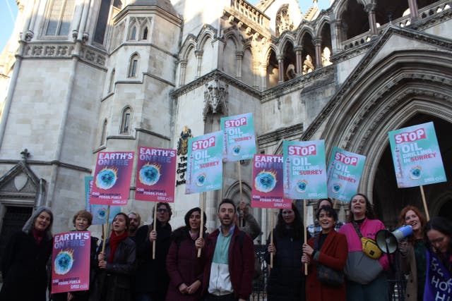 <p>Climate activists protest against oil drilling in the Surrey Hills outside the Royal Courts of Justice on 16 November, 2021. </p>