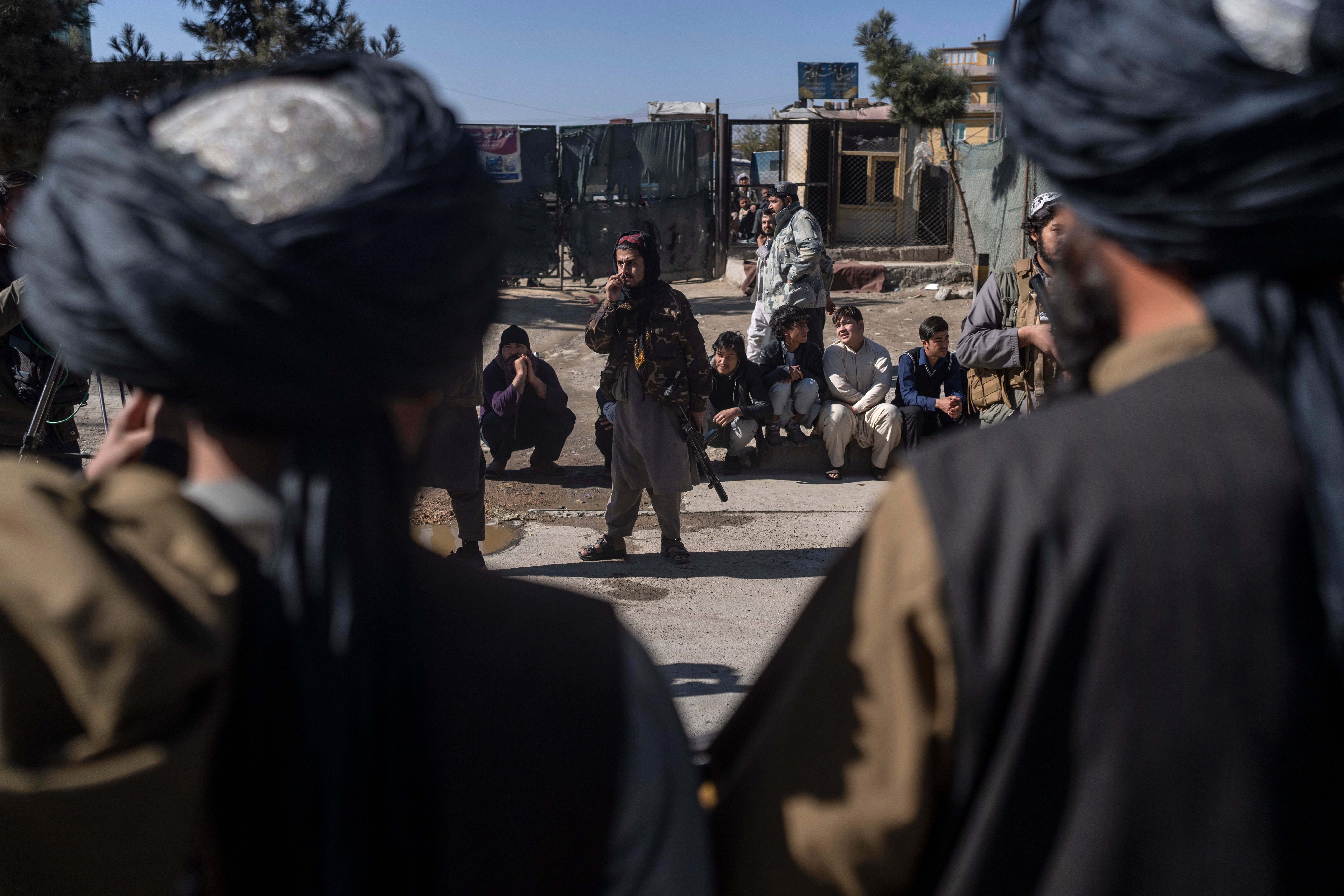 Taliban fighters secure the area after a roadside bomb went off in Kabul earlier this month