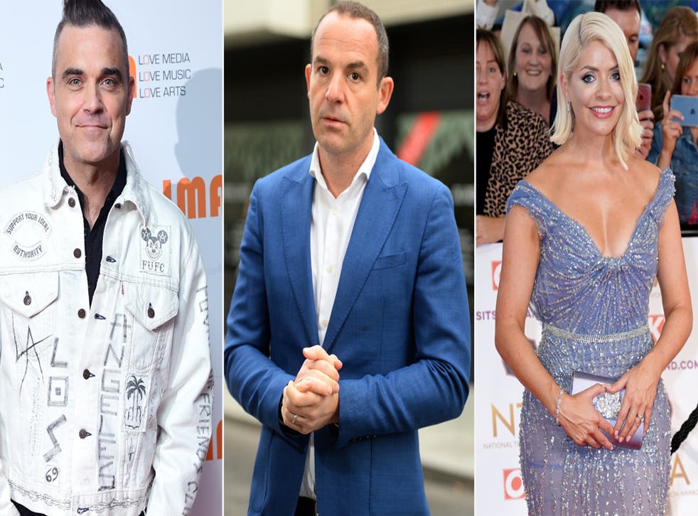 Robbie Williams, Martin Lewis and Holly Willoughby among celebrities who have signed a letter to the Prime Minister asking for paid scam ads to be included in the Online Safety Bill ( Kirsty O’Connor/Ian West/PA)
