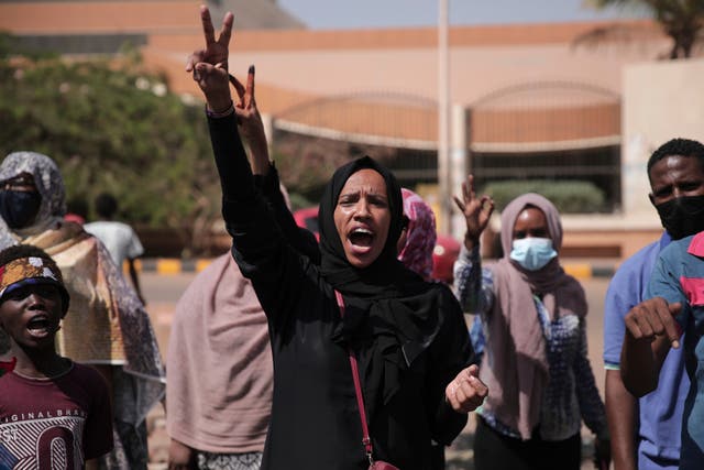 <p>A woman chants slogans during a protest in Khartoum, Sudan</p>