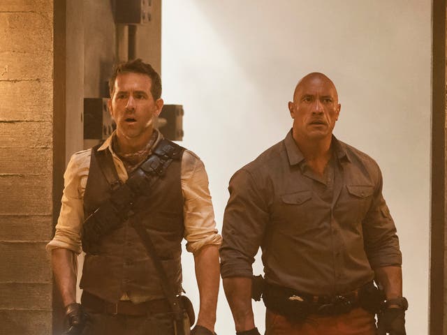 <p>Ryan Reynolds and Dwayne Johnson in ‘Red Notice’</p>