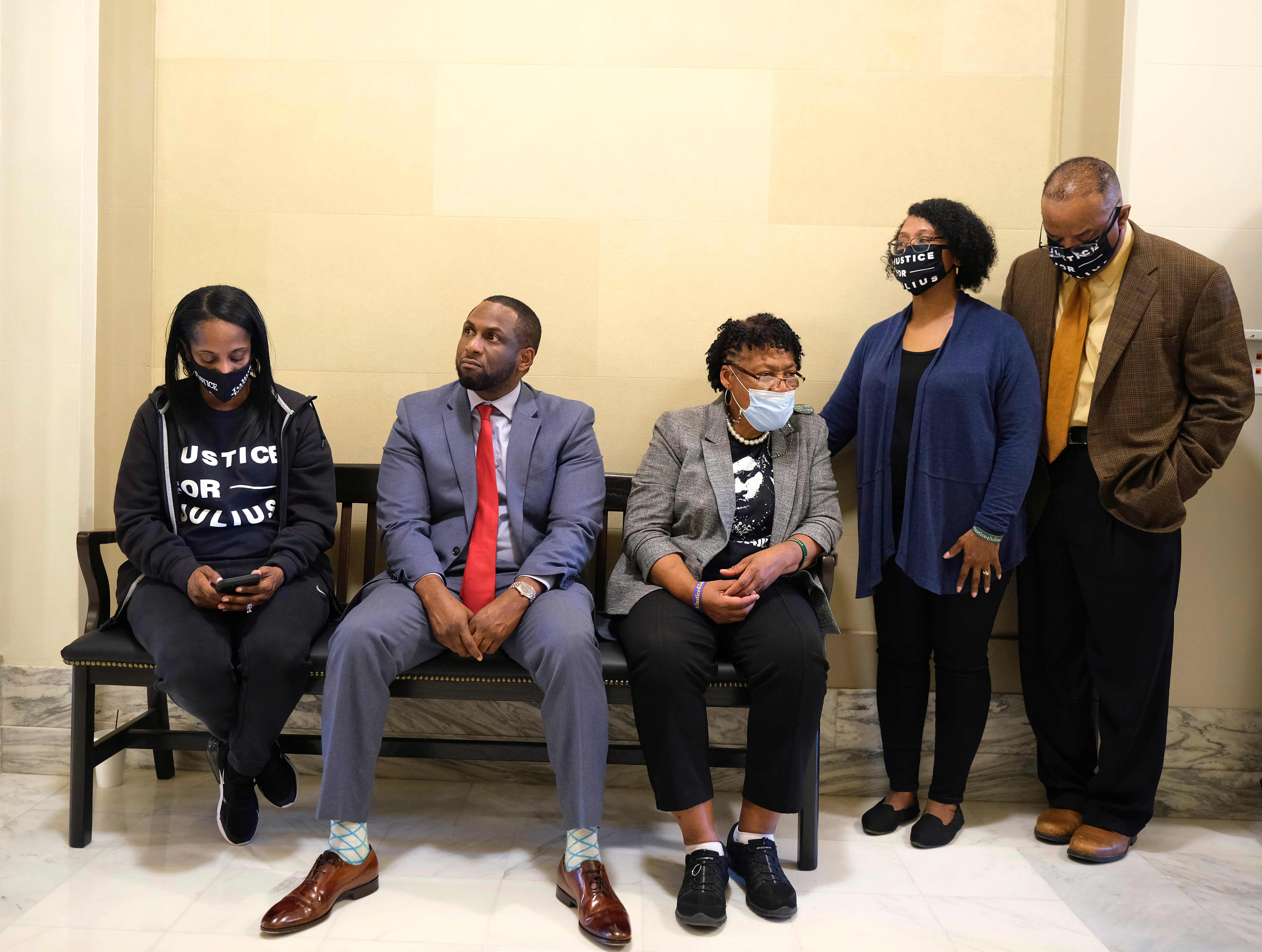 From left to right, Quinita Jones (no relation), Rep. Jason Lowe, Madeline Davis-Jones, mother of death row inmate Julius Jones, and Dionne and Rev. Marcus Carruthers wait on a bench outside of Oklahoma Gov. Kevin Stitt’s office, hoping for a meeting with him, at the Oklahoma Capitol in Oklahoma City, Monday, Nov. 15, 2021. (Doug Hoke/The Oklahoman via AP)