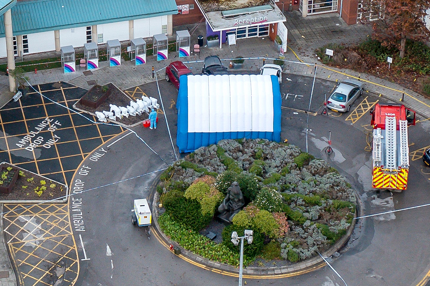 Police officers carrying out forensic investigations at the scene