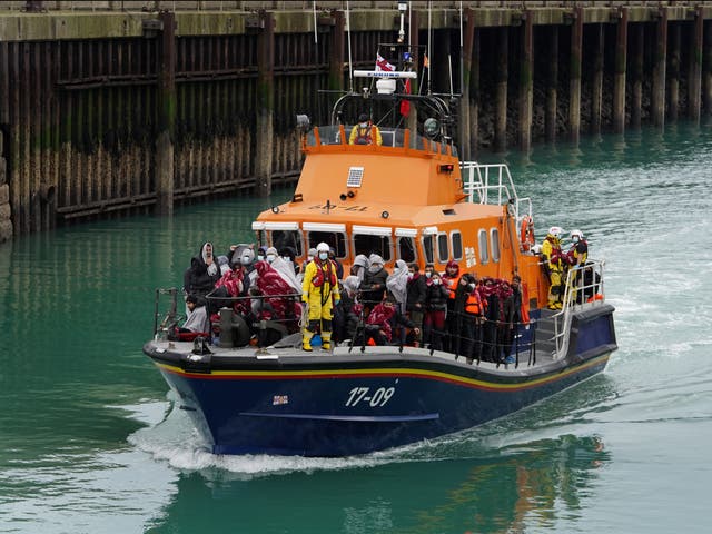 <p>A group of people believed to be migrants intercepted in the Channel are brought into Dover by a lifeboat</p>