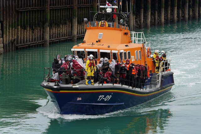 <p>A group of people believed to be migrants intercepted in the Channel are brought into Dover by a lifeboat</p>
