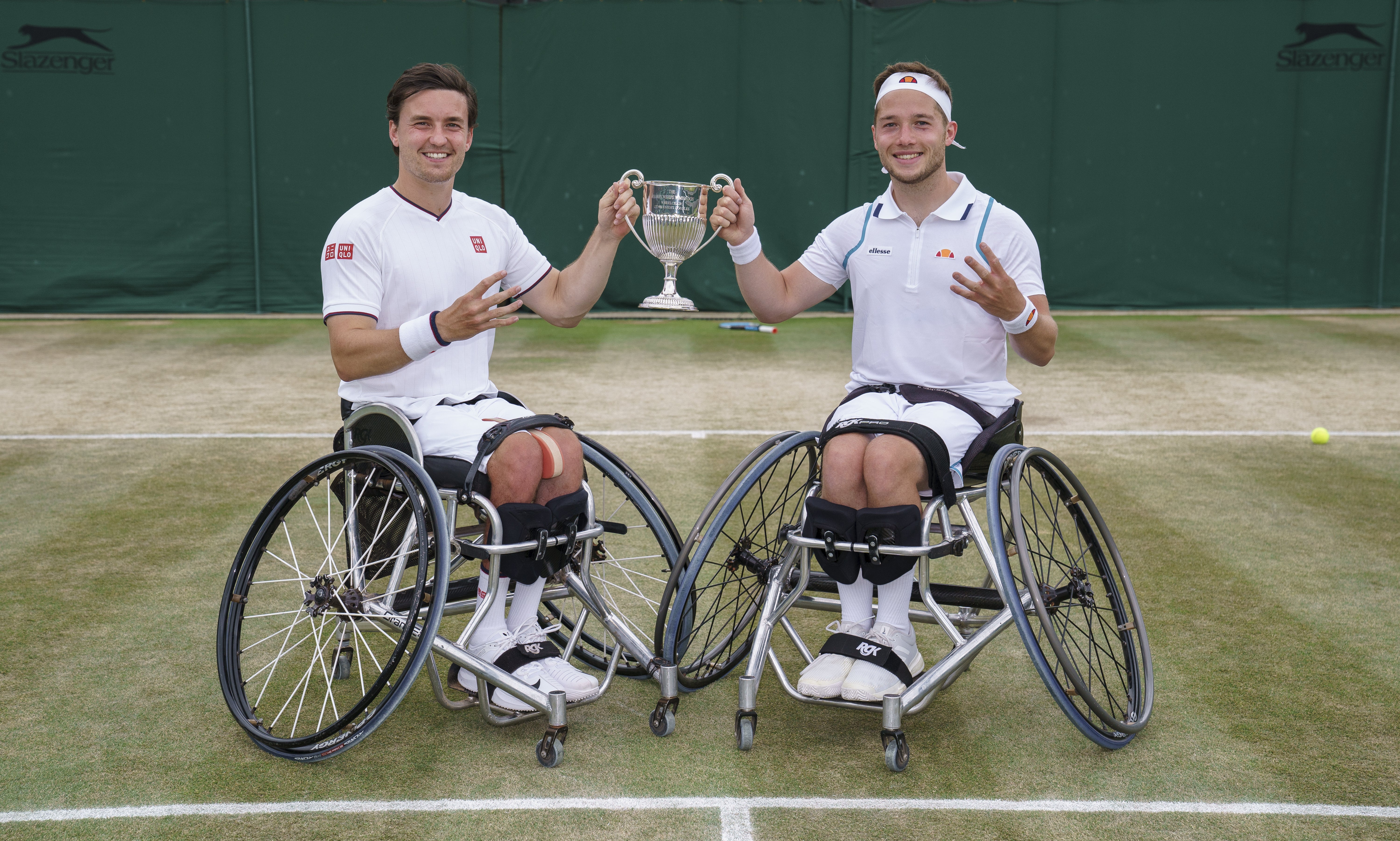 Alfie Hewett and Gordon Reid hold aloft the Wimbledon doubles trophy (Jon Super/AELTC Pool)