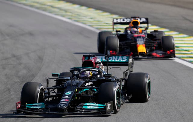<p>Lewis Hamilton, front, was able to pass Max Verstappen later in the race after they clashed at Interlagos (Andre Penner/AP)</p>
