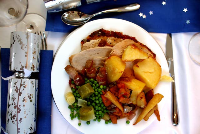 General view of a traditional Christmas Dinner on Christmas Day (David Davies/PA)