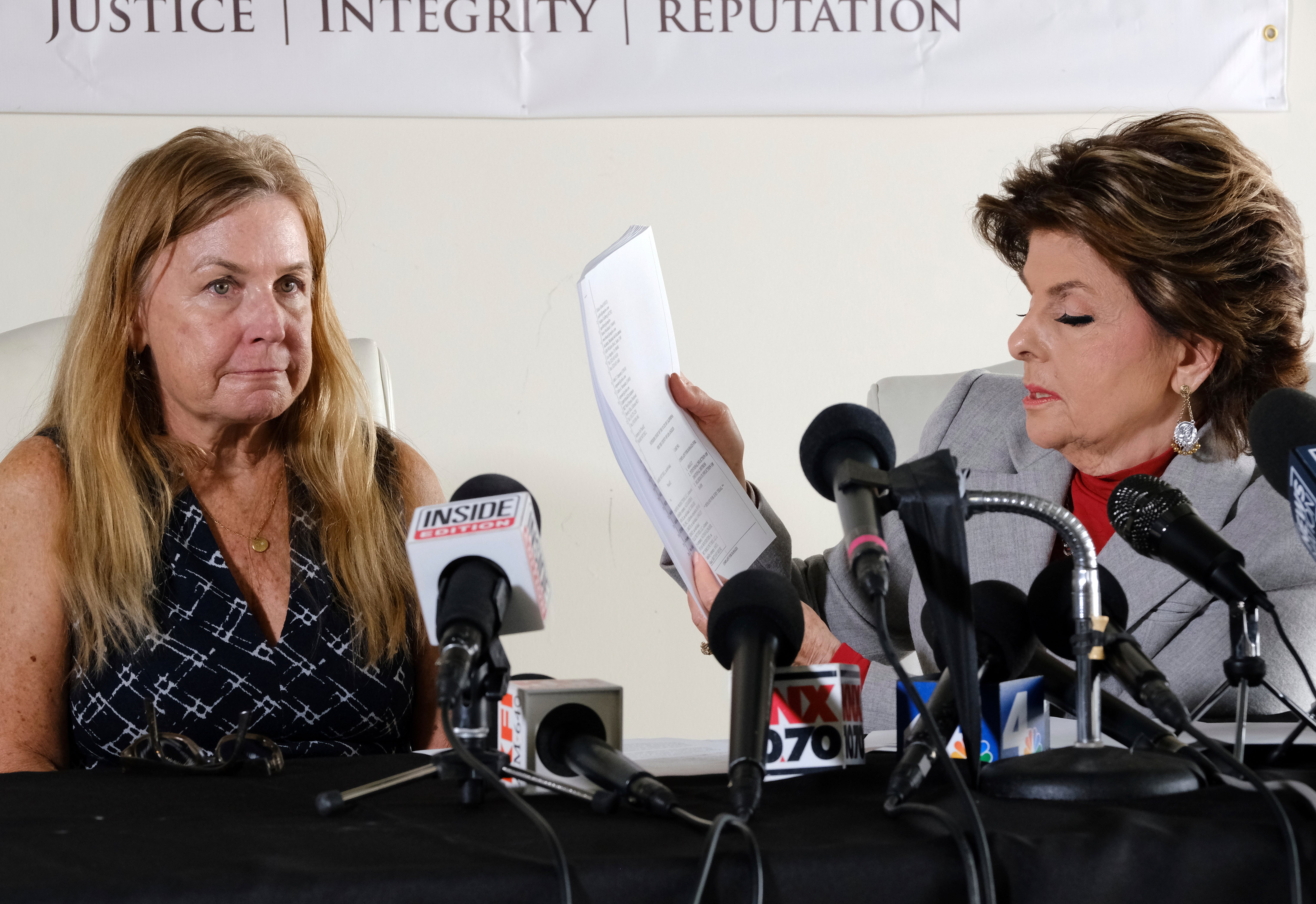Script Supervisor Mamie Mitchell, left, appears with her attorney Gloria Allred during a news conference on Wednesday, Nov. 17, 2021 in Los Angeles.